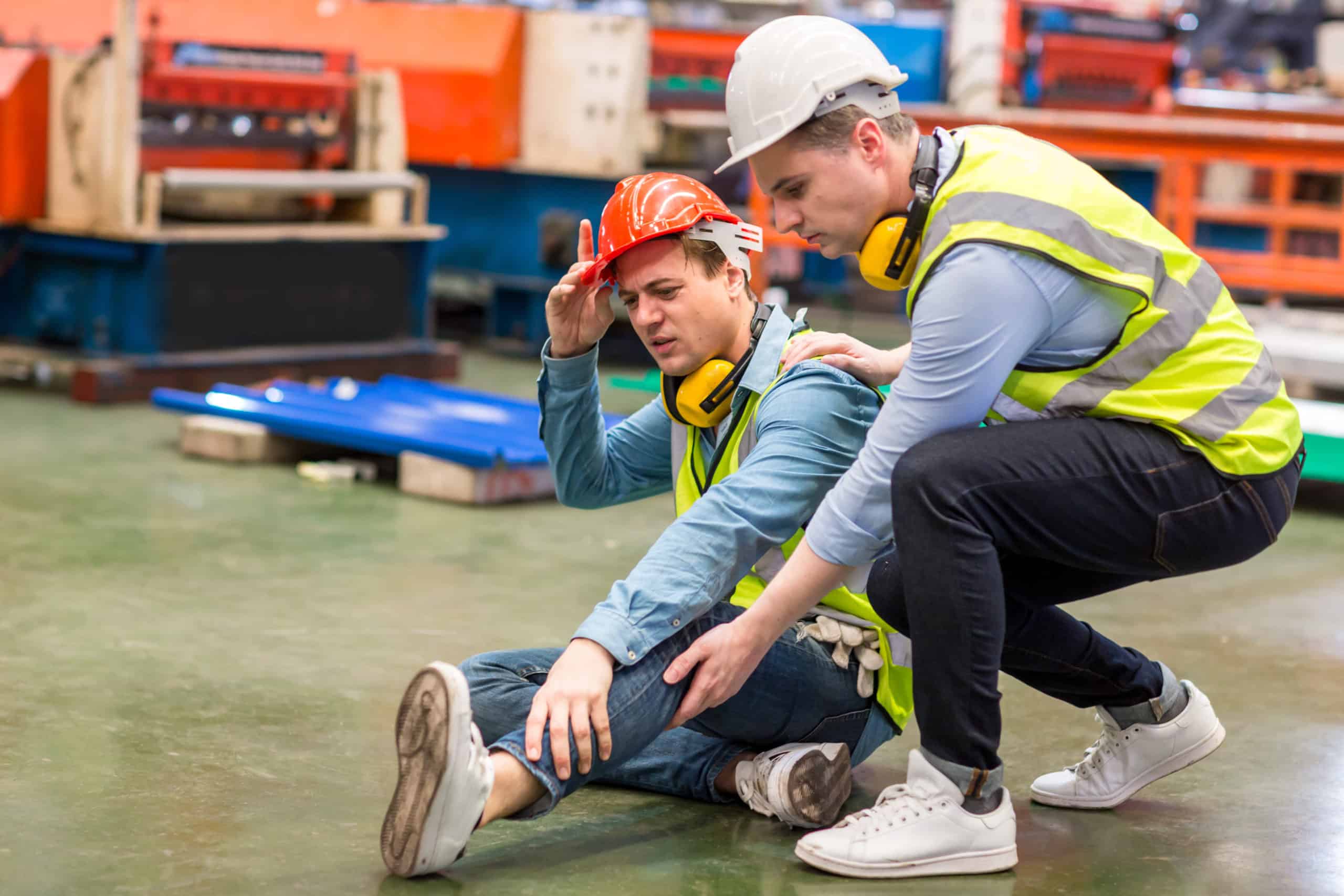 First aid support accident at work of worker at factory. Male wo