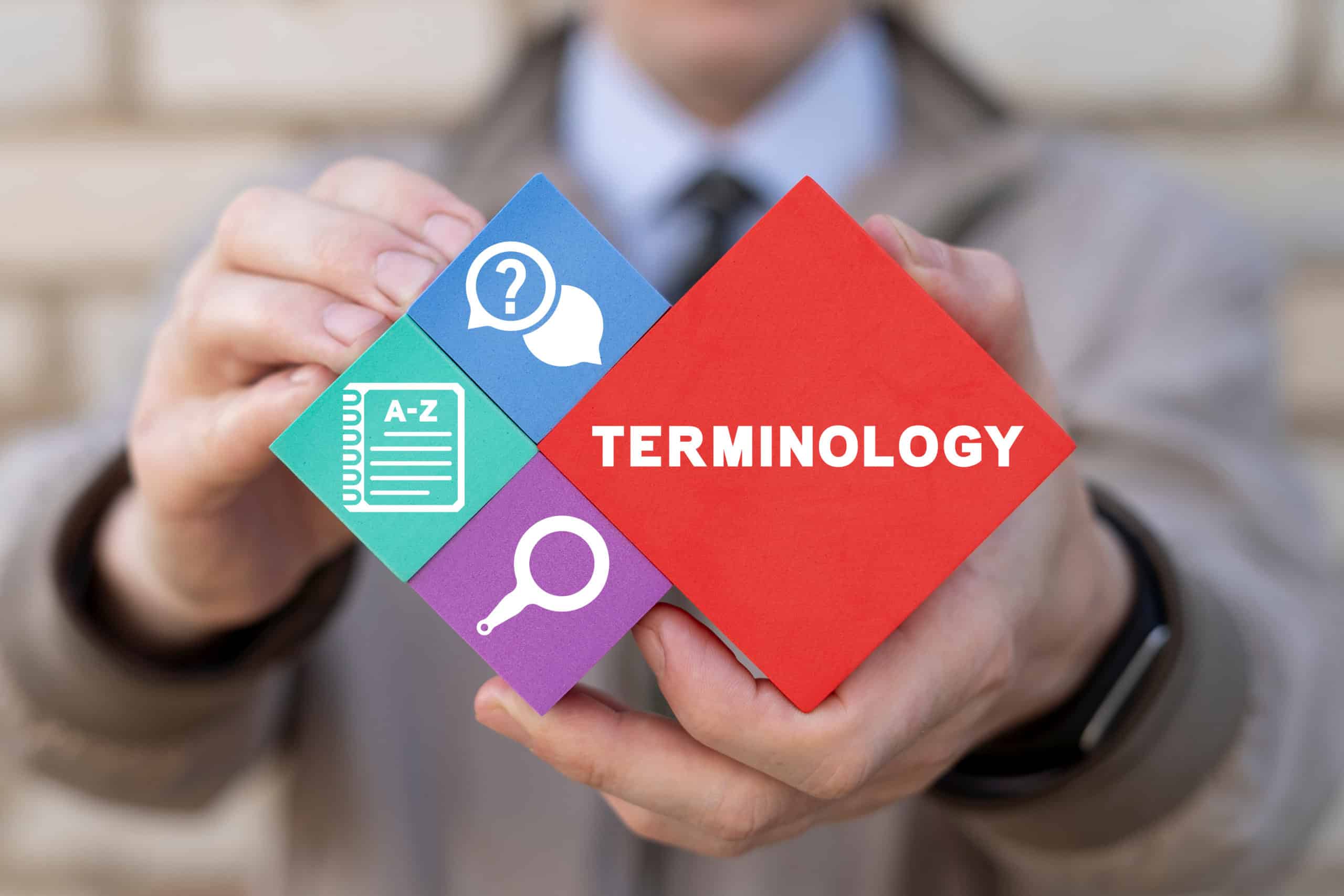 Bausteine der Übersetzung Bausteine mit der Aufschrift "Terminology" und Piktogrammen zum Thema Übersetzung